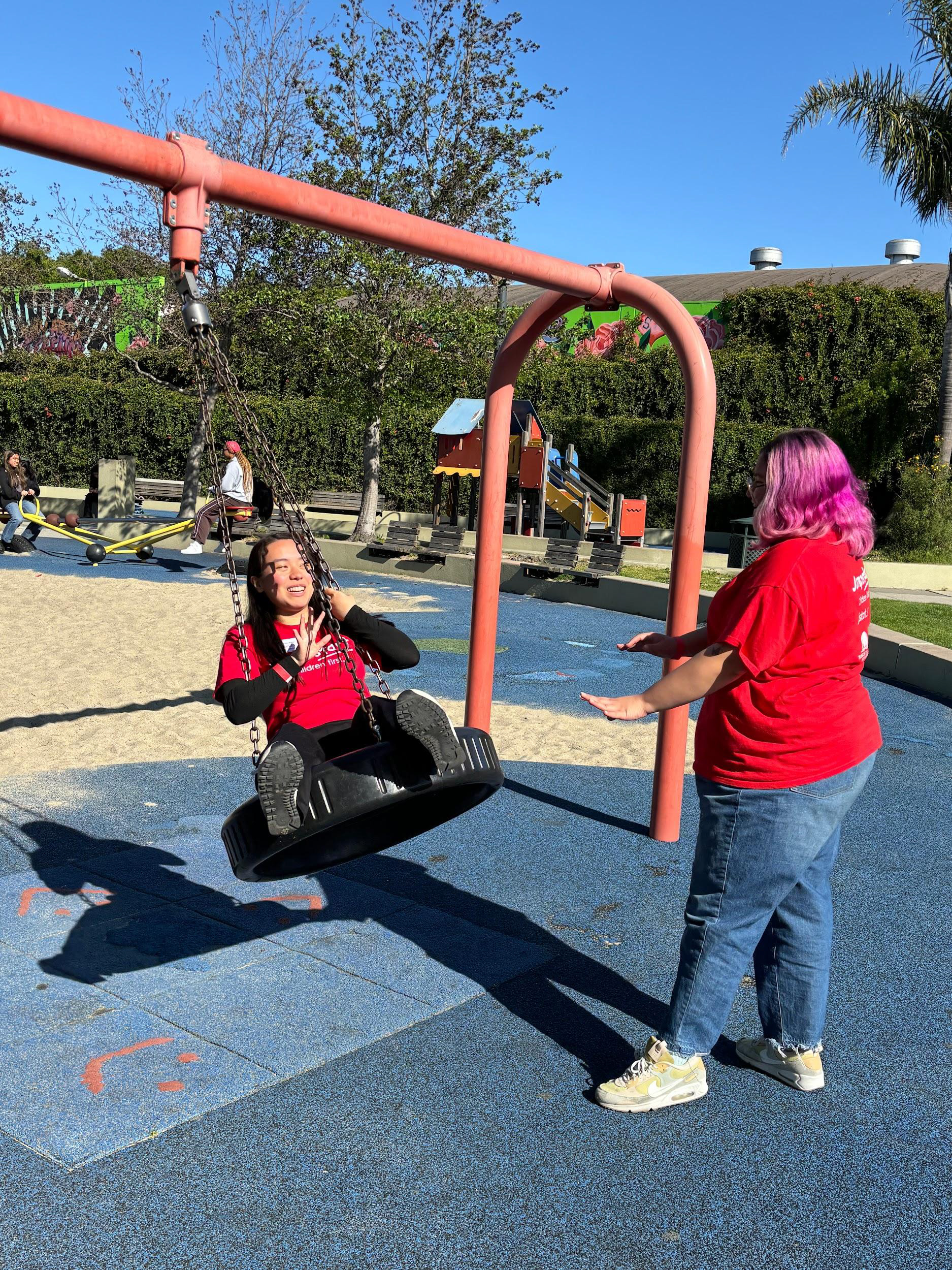 Jumpstart mentees on the swings