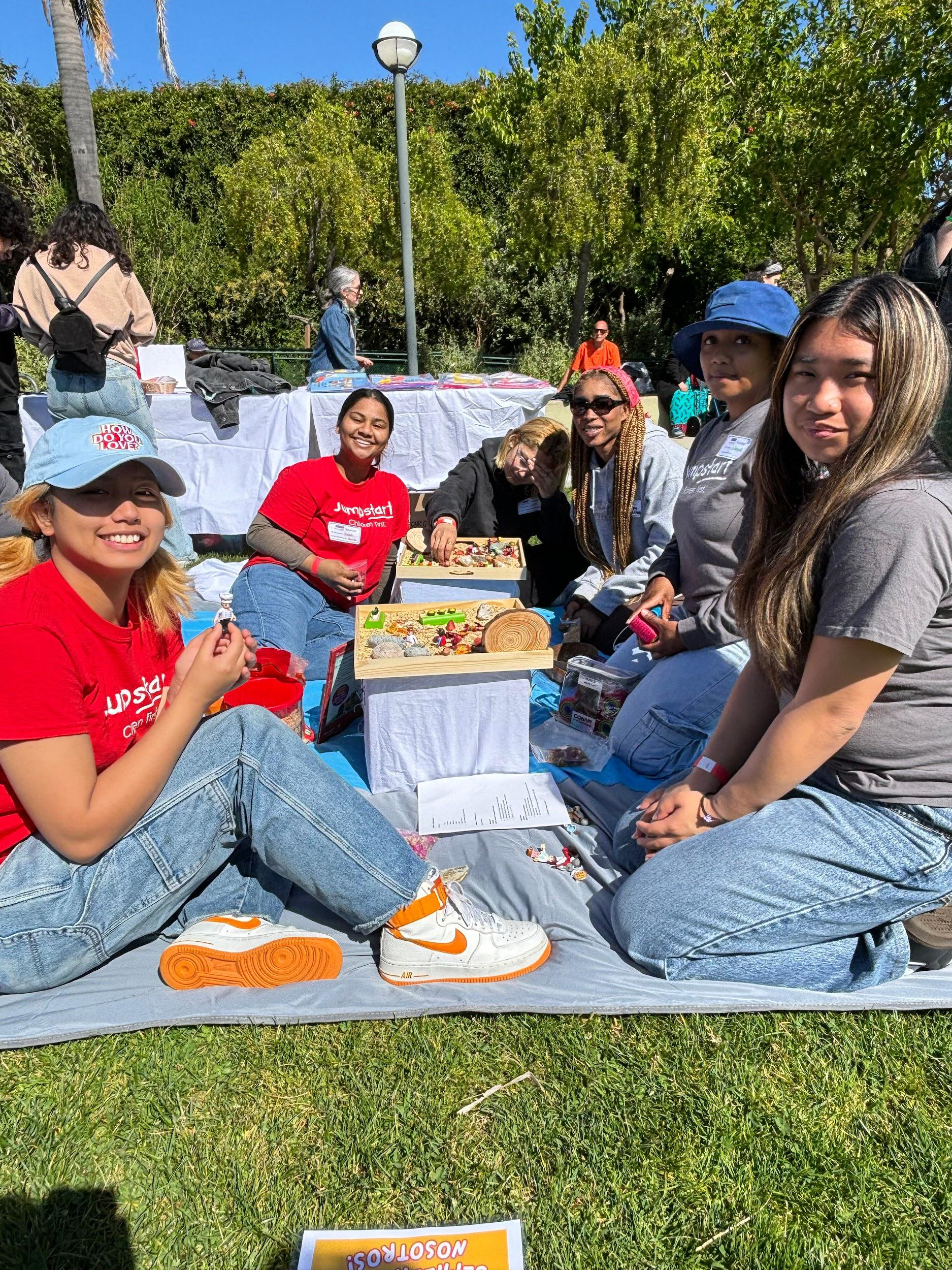 Jumpstart mentees on a picnic mat