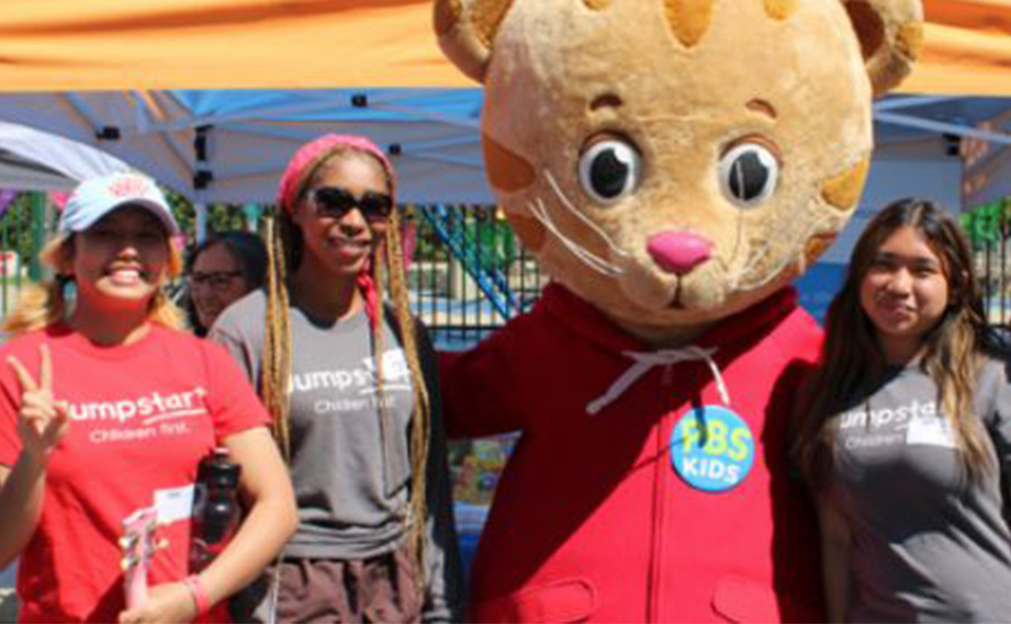 Students posing with a mascot