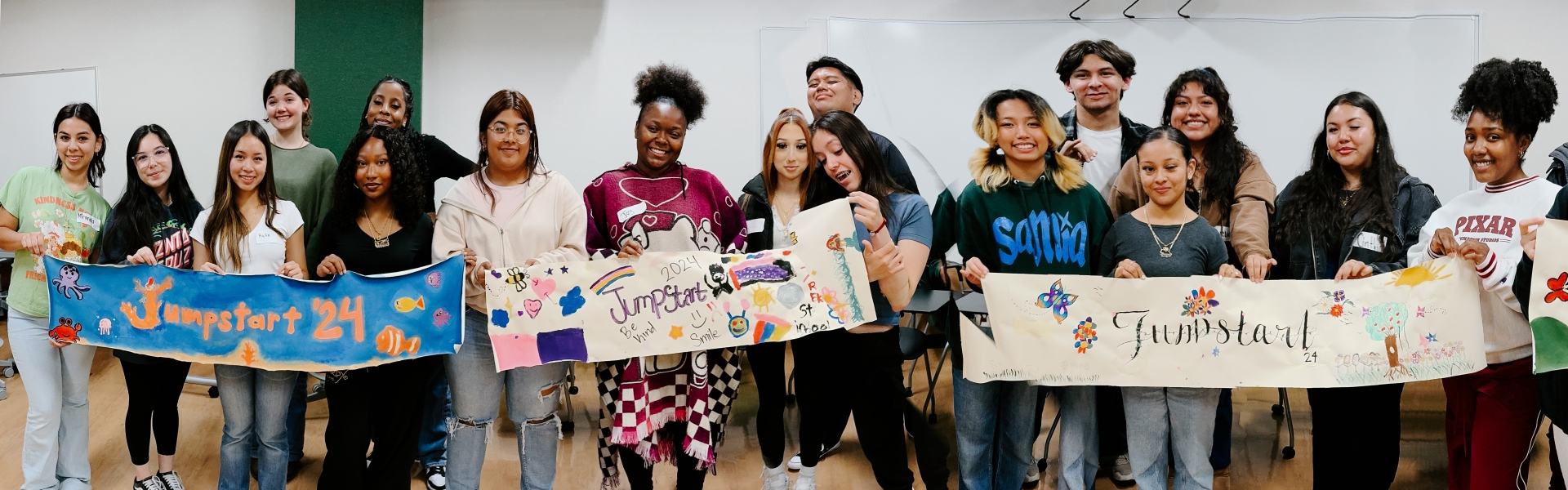 Students holding up Jumpstart banners